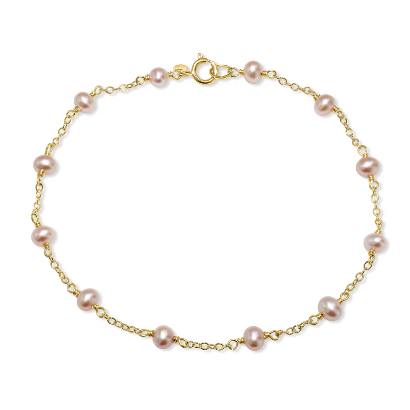 Experience the divine elegance of the 14k Natural Pink Pearl Station Bracelet from the Goddess Jewelry Collection , featuring a minimalist gold chain with evenly spaced pink pearls and a simple clasp for grace and sophistication.