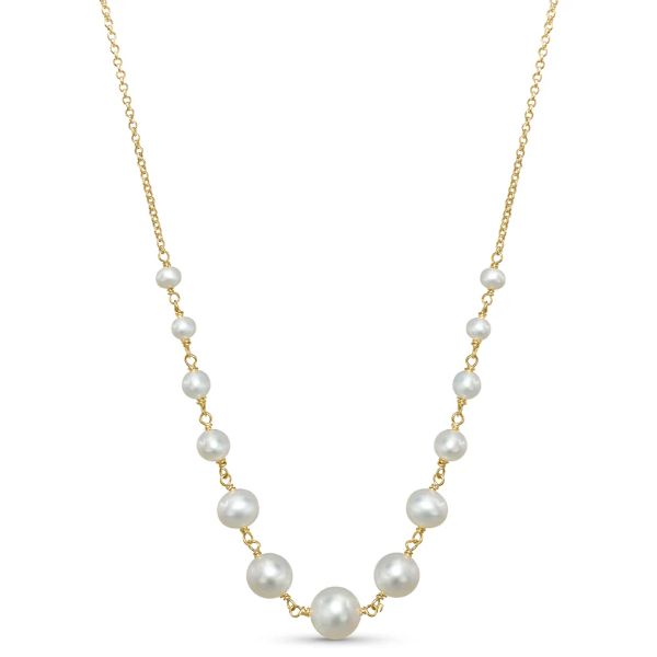 The 14k White Freshwater Pearl Wire Necklace from the Goddess Jewelry Collection  exudes elegance with its symmetrical design, featuring white pearls of varying sizes evenly spaced on a gold chain.