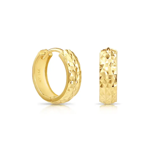 The 14K Gold Textured 13mm Huggie Earrings from Goddess Jewelry feature a faceted design, with one shown open and the other closed, showcasing their intricate and shiny yellow gold surface.