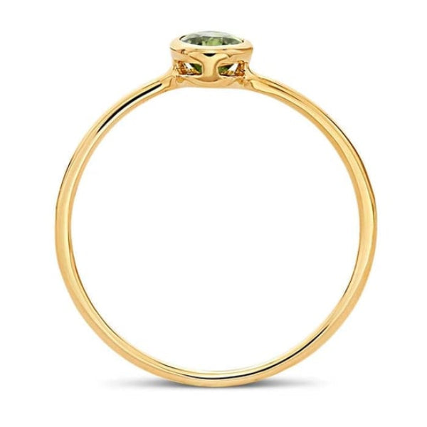 The Rio Grande 14K Yellow Gold Oval Peridot Ring (Size 7) features a delicate four-prong setting and a AAA-Grade Peridot, showcasing its minimalistic elegance with a thin, polished band.