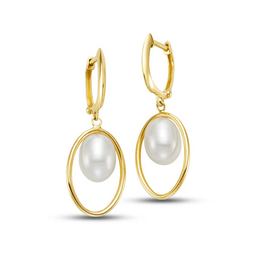14k Freshwater White Pearl Huggie Hoop Earrings feature oval gold hoops holding smooth pearls via small clasp hooks, contrasting their glossy surfaces with the hoops' shine.