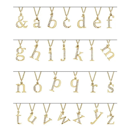 14K Dainty Lowercase Initial Diamond Necklaces  from the Goddess Jewelry Collection display pendants from A to Z, plus an ampersand. Each piece features a diamond-studded initial on a gold chain, perfect as personalized gifts. Four rows showcase the entire alphabet in lowercase letters.