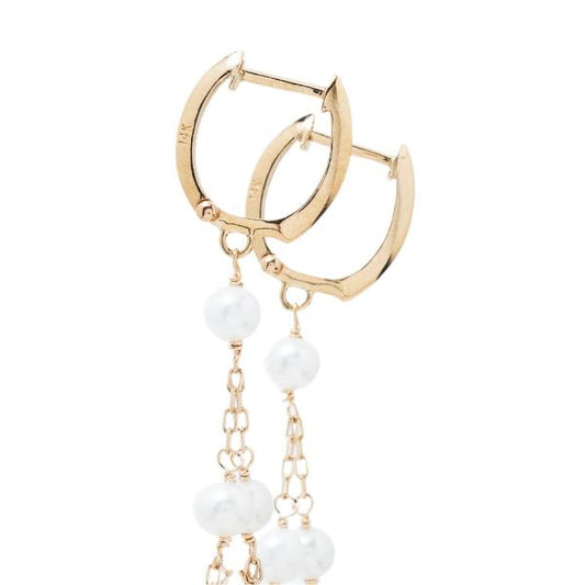 Jewelmak's 14k White Freshwater Pearl Chandelier Hoop Earrings feature close-up huggie hoops with polished finishes, attached to delicate chains adorned with AAA+ quality white pearls, exuding elegance and sophistication against a plain white background.