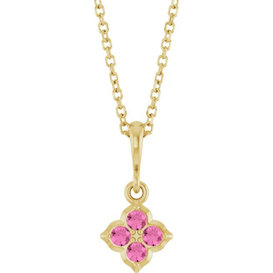 The Stuller Youth 14K Lab-Grown Pink Sapphire Necklace features a 14k yellow gold chain with a flower-shaped pendant of four lab-grown pink sapphires, polished bail, and intricate detailing for an elegant look.