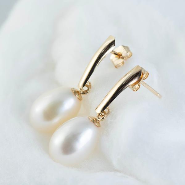 14K Yellow Gold Freshwater Pearl Drop Earrings elegantly displayed against a soft, white fabric backdrop.