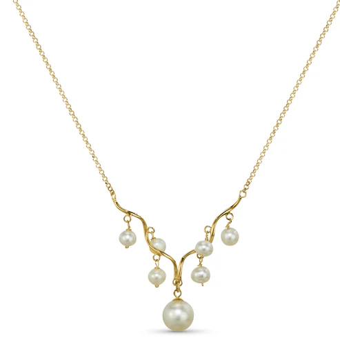 The Jewelmak 14k White Pearl Wave Bar Necklace showcases a delicate series of pearls in varying sizes, culminating in the largest at the bottom. These pearls elegantly dangle from a central curved design and reflect off a subtle gold bar on a thin, elegant chain.