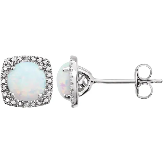 Stuller's Sterling Silver Lab-Grown White Opal Earrings showcase round opals in square sterling silver bases adorned with tiny sparkling stones and a standard push-back closure. The opals feature a subtly iridescent quality, reflecting various hues.