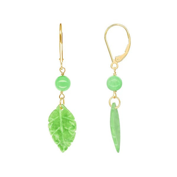 14k Green Jade Leaf Leverback Drop Earrings feature nature-inspired designs with 14k yellow gold hooks. One earring is adorned with a green bead and leaf charm, while the other displays a slender charm, creating a beautifully shiny appearance that emphasizes their natural elegance. These earrings are perfect for any occasion.