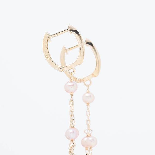 The 14k Pink Freshwater Pearl Chandelier Huggie Hoop Earrings, featuring dangling pearl chains in a yellow gold setting, are set against a plain white background.