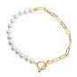 The Jewelmak 14k White Freshwater Pearl Paperclip Chain Toggle Bracelet, measuring 7.5 inches, is an elegant piece crafted from solid yellow gold and highlighted by a string of white freshwater pearls seamlessly connected to the chain with a toggle clasp, embodying timeless sophistication.