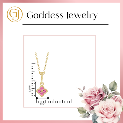 A Youth Lab-Grown Pink Sapphire 14K Yellow Gold Necklace is displayed, featuring a pendant with lab-grown pink sapphire gemstones measuring 9.1mm by 7mm. The image prominently features the Stuller logo and name at the top, with pink roses adorning the bottom right corner.