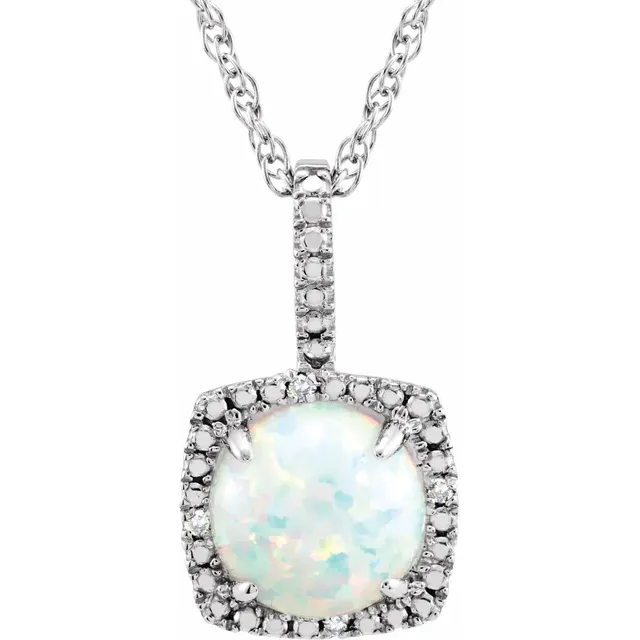 The Stuller Sterling Silver Lab-Grown White Opal Necklace features a square opal pendant with iridescent hues, bordered by clear gemstones. Its textured chain enhances the pendant's elegance, making it a stunning jewelry collection addition.