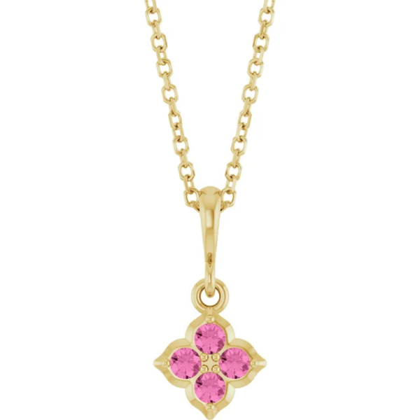 The Youth Lab-Grown Pink Sapphire 14K Yellow Gold Necklace features a chain with a floral-inspired pendant, showcasing lab-grown pink sapphires shaped like a four-petaled flower.